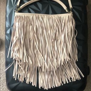 Fringe cross body bag with arm handle as well.